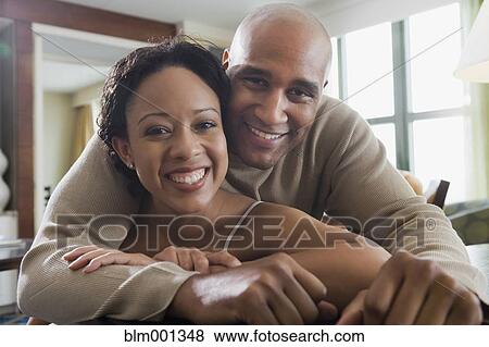 African couple hugging View Large Photo Image Stock Photo - African couple hugging. Fotosearch