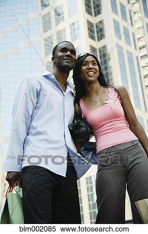 Stock Photography - African couple in urban scene. Fotosearch