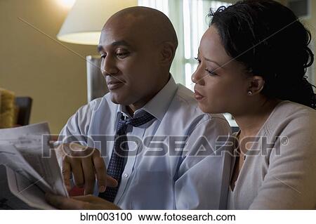 African couple reading newspaper View Large Photo Image Stock Image - African couple reading newspaper. Fotosearch