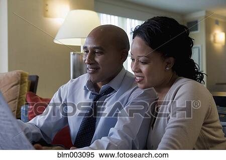 African couple reading newspaper View Large Photo Image Stock Photography - African couple reading newspaper. Fotosearch