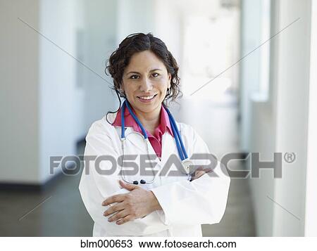 African doctor in lab coat with arms crossed View Large Photo Image Stock Image - African doctor in lab coat with arms crossed. Fotosearch