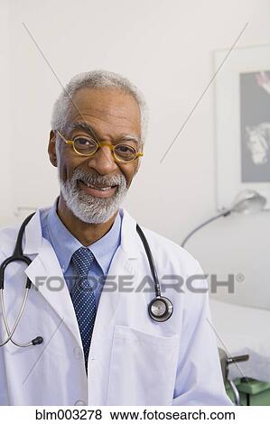 African doctor smiling View Large Photo Image Stock Photo - African doctor smiling. Fotosearch