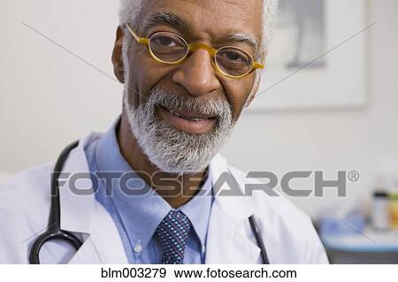Stock Photo - African doctor smiling. Fotosearch