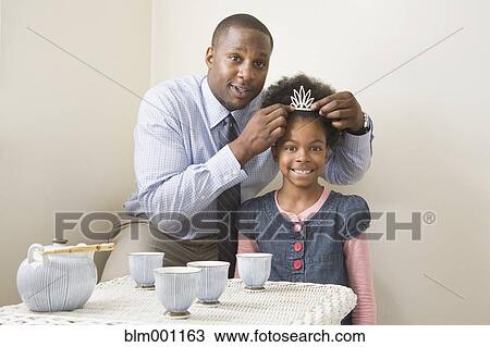 African father and daughter posing with tiara View Large Photo Image Stock Image - African father and daughter posing with tiara. Fotosearch