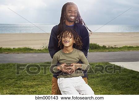 African father playing with son View Large Photo Image Stock Image - African father playing with son. Fotosearch