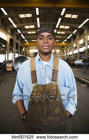 Stock Photography - African female worker in warehouse. Fotosearch