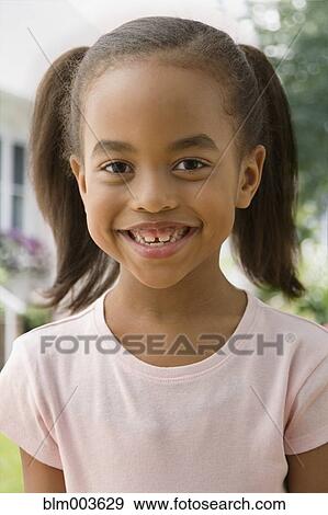African girl smiling View Large Photo Image Stock Photo - African girl smiling. Fotosearch
