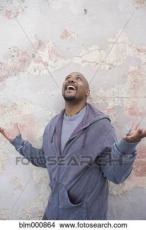 African man by wall looking up View Large Photo Image Picture - African man by wall looking up. Fotosearch