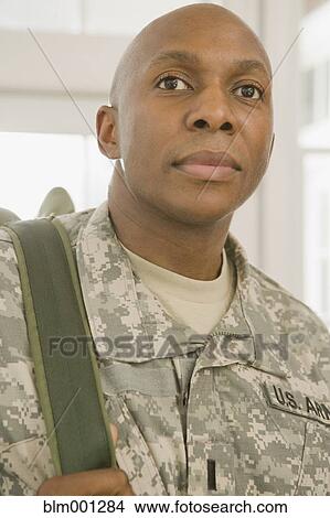 Picture - African man in military uniform. Fotosearch