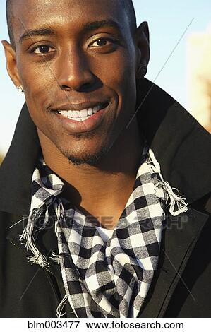 African man in scarf and trench coat View Large Photo Image Stock Photo - African man in scarf and trench coat. Fotosearch
