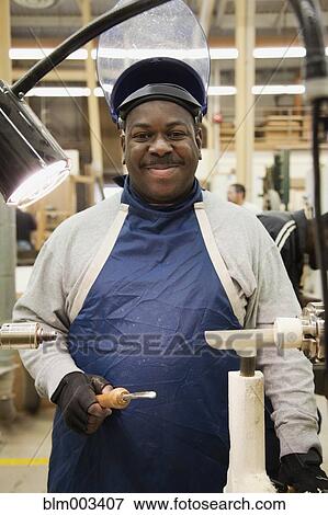 African man in workshop View Large Photo Image Stock Photo - African man in workshop. Fotosearch