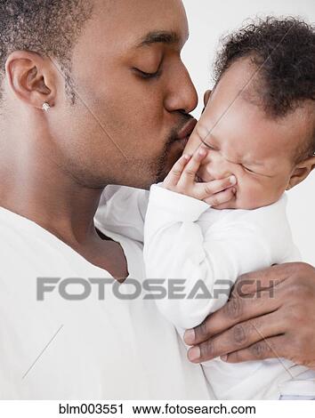 African man kissing baby View Large Photo Image Stock Image - African man kissing baby. Fotosearch