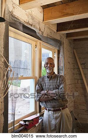 African man leaning against window View Large Photo Image Stock Photography - African man leaning against window. Fotosearch
