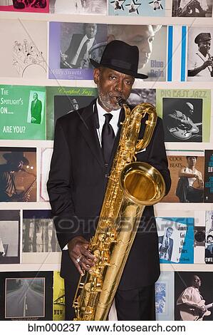 African man performing on saxophone View Large Photo Image Stock Photo - African man performing on saxophone. Fotosearch