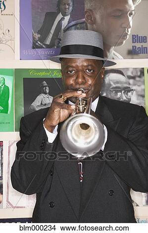 African man performing on trumpet View Large Photo Image Picture - African man performing on trumpet. Fotosearch