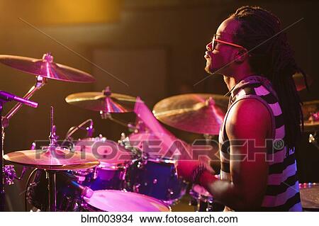 African man playing drums onstage View Large Photo Image Picture - African man playing drums onstage. Fotosearch