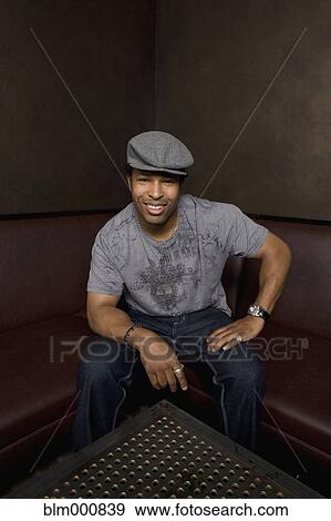 African man sitting in nightclub View Large Photo Image Stock Photo - African man sitting in nightclub. Fotosearch