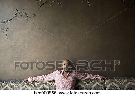 African man sitting in nightclub View Large Photo Image Stock Photograph - African man sitting in nightclub. Fotosearch