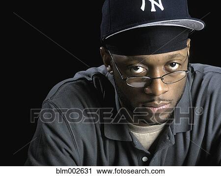 Stock Image - African man wearing eyeglasses. Fotosearch