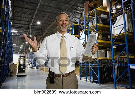 African man working in warehouse View Large Photo Image Stock Photo - African man working in warehouse. Fotosearch