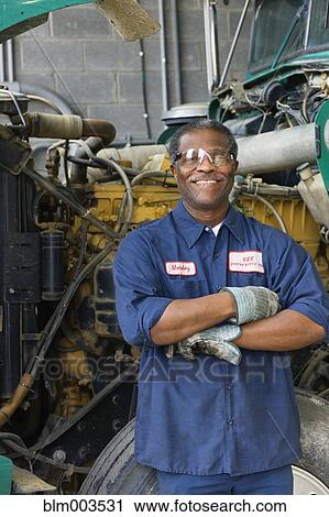 Stock Image - African mechanic in repair shop. Fotosearch
