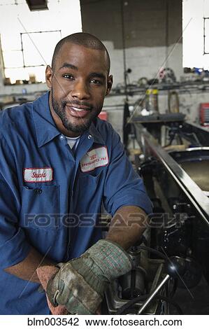 African mechanic in repair shop View Large Photo Image Stock Image - African mechanic in repair shop. Fotosearch