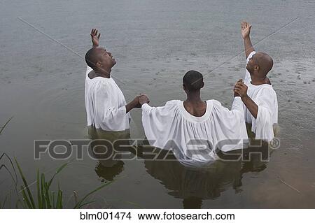 African men and boy getting baptized in lake View Large Photo Image Picture - African men and boy getting baptized in lake. Fotosearch