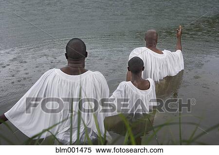 African men and boy getting baptized in lake View Large Photo Image Stock Photography - African men and boy getting baptized in lake. Fotosearch