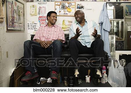 African men sitting in shoe shine stall View Large Photo Image Stock Photo - African men sitting in shoe shine stall. Fotosearch