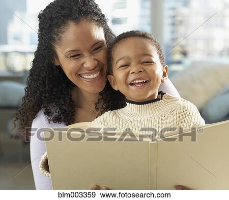 African mother reading to son View Large Photo Image Stock Photo - African mother reading to son. Fotosearch