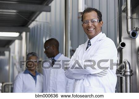 African scientists standing in factory View Large Photo Image Stock Photograph - African scientists standing in factory. Fotosearch