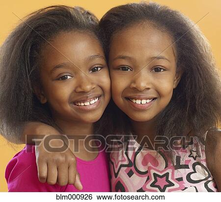 African sisters hugging View Large Photo Image Stock Photograph - African sisters hugging. Fotosearch