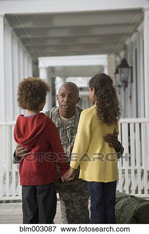 Stock Photo - African soldier hugging girlfriend. Fotosearch