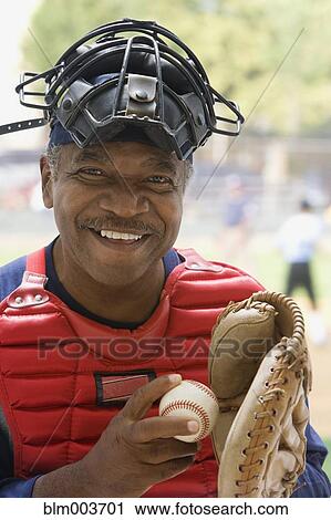 Stock Image - African umpire smiling. Fotosearch