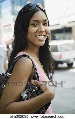 African woman carrying purse View Large Photo Image Stock Photography - African woman carrying purse. Fotosearch