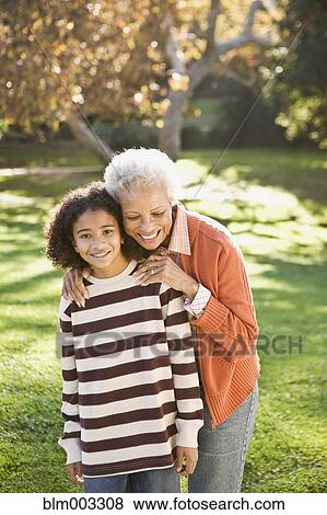 African woman hugging granddaughter View Large Photo Image Stock Photo - African woman hugging granddaughter. Fotosearch