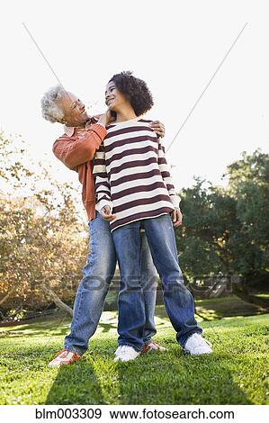 African woman hugging granddaughter View Large Photo Image Stock Photo - African woman hugging granddaughter. Fotosearch