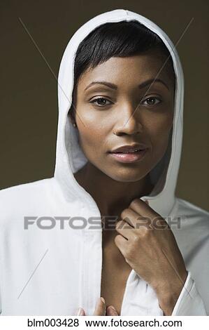 Stock Photo - African woman in hooded shirt. Fotosearch