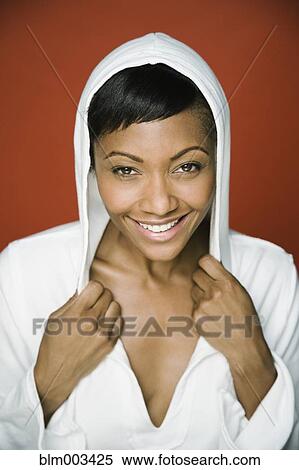 Stock Photography - African woman in hooded shirt. Fotosearch