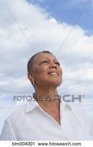 African woman looking up View Large Photo Image Stock Image - African woman looking up. Fotosearch