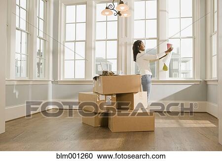 African woman moving house View Large Photo Image Stock Image - African woman moving house. Fotosearch