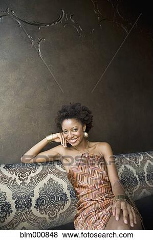 African woman sitting in nightclub View Large Photo Image Stock Photo - African woman sitting in nightclub. Fotosearch