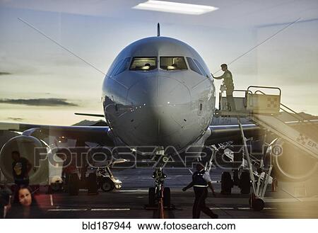 Picture - Airplane parked in gate at airport. Fotosearch