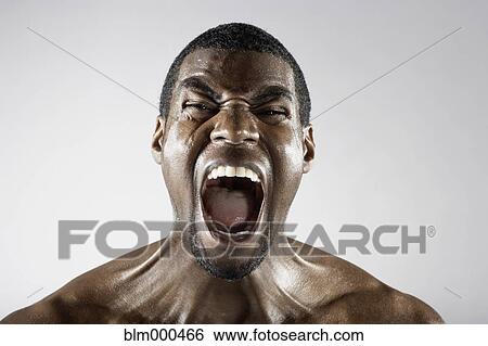 Stock Photograph - Angry African man shouting. Fotosearch