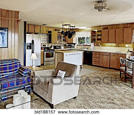 Armchair and countertops in open living room and kitchen View Large Photo Image Stock Photo - Armchair and countertops in open living room and kitchen. Fotosearch