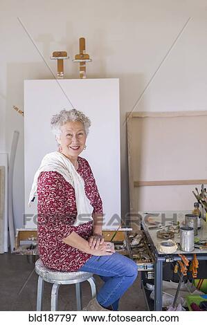 Artist smiling in studio View Large Photo Image Stock Photo - Artist smiling in studio. Fotosearch
