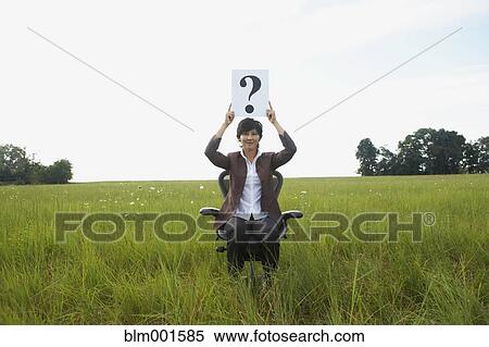 Asian businesswoman holding question mark in field View Large Photo Image Stock Photography - Asian businesswoman holding question mark in field. Fotosearch