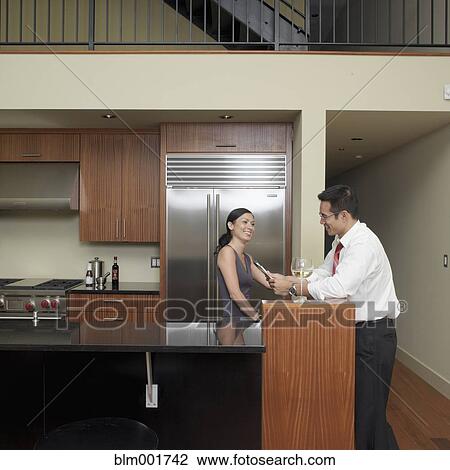 Asian couple in kitchen View Large Photo Image Stock Image - Asian couple in kitchen. Fotosearch