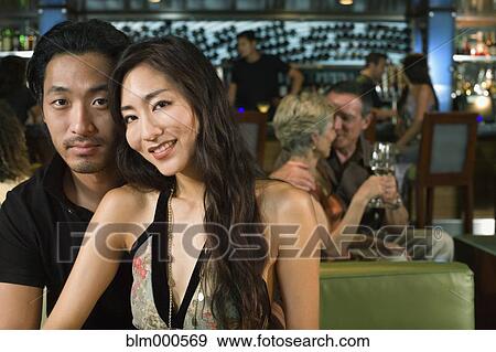 Stock Photo - Asian couple in nightclub. Fotosearch