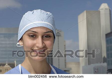Stock Photograph - Asian female medical professional outdoors. Fotosearch
